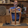 Man with a wooden stool