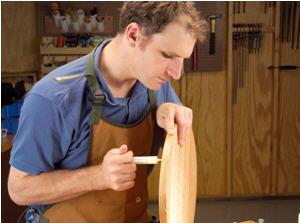 Photo 5. I inject glue into the holes from the bottom side of the table to saturate each hole and the small fibers. Once I see glue coming through the hole, I know it’s ready for clamping.