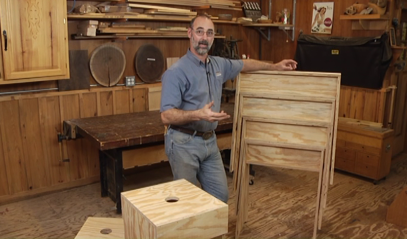 Man making a wooden bookcase