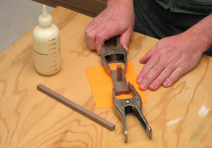 Make the square hole chopping jig from four pieces cut off the plug stock stick. Glue the pieces together using another piece to define the square hole in the jig’s center. Pull that piece out after the glue has set for a few minutes.