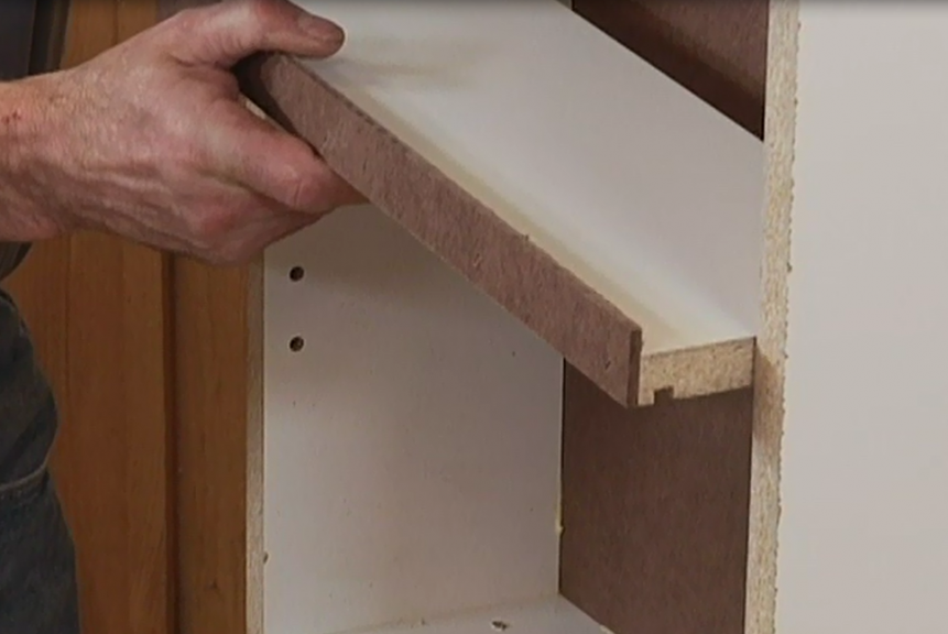 Adding a shelf to a cabinet