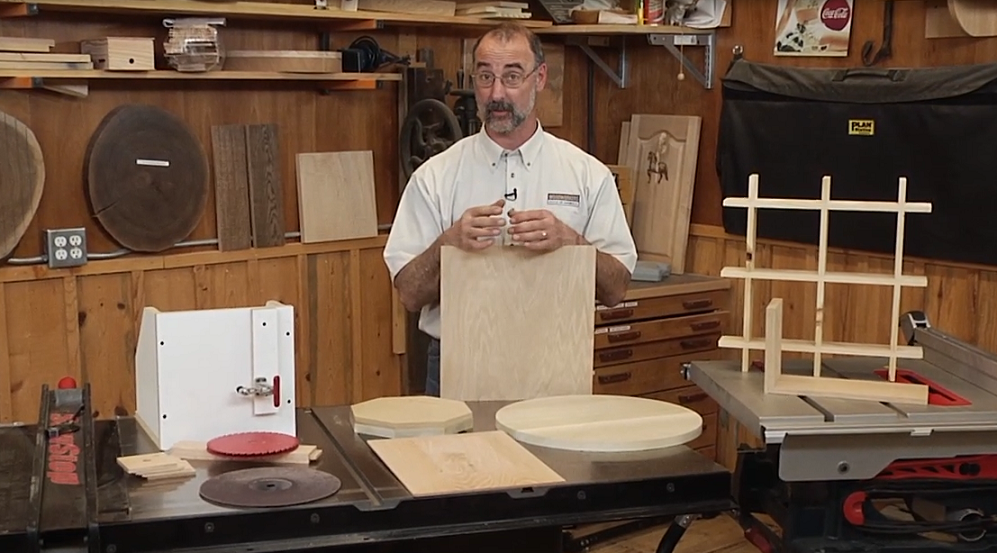 Man with different shaped wood pieces