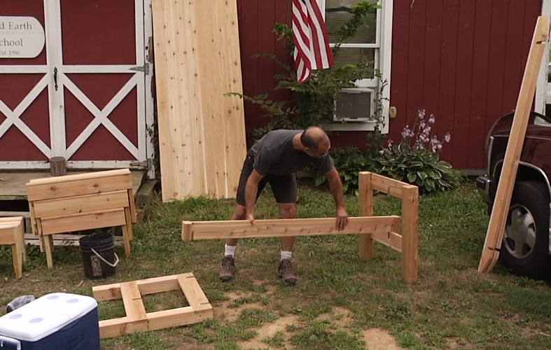 Man building a picnic table