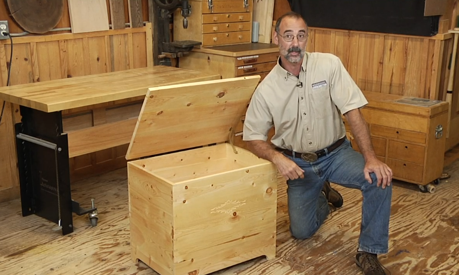 Man with a wooden chest