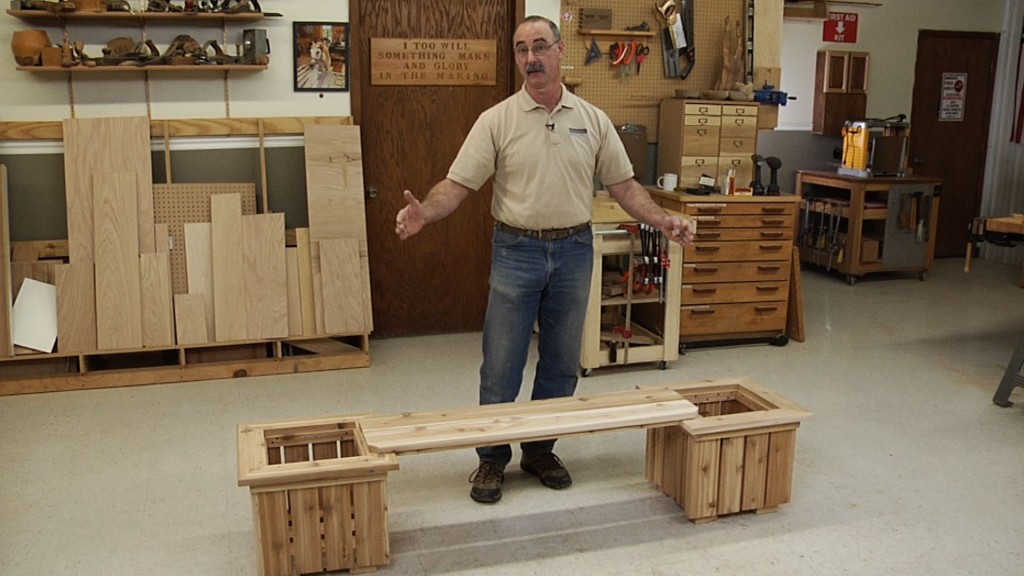 Man building wooden planters