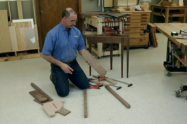 Man with wood pieces on the floor