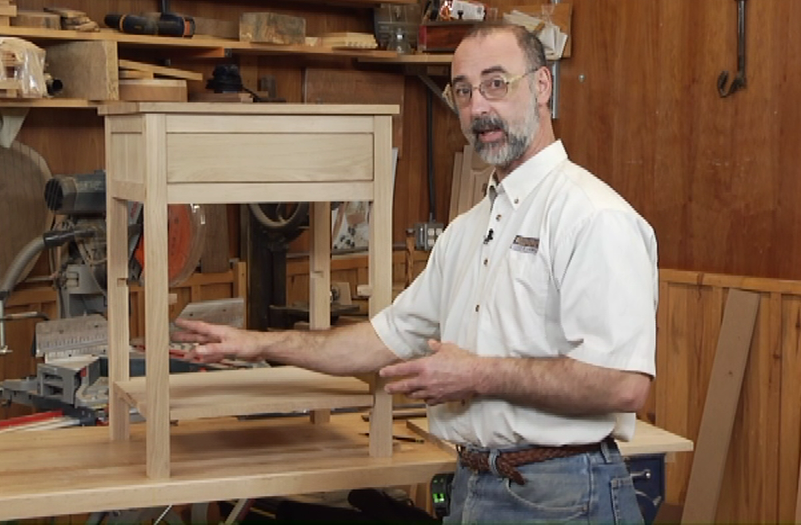 Man with a small end table