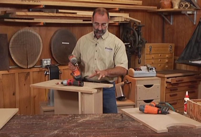 Man wood working with a power tool