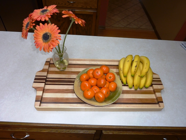 Wooden tray with flowers and fruit
