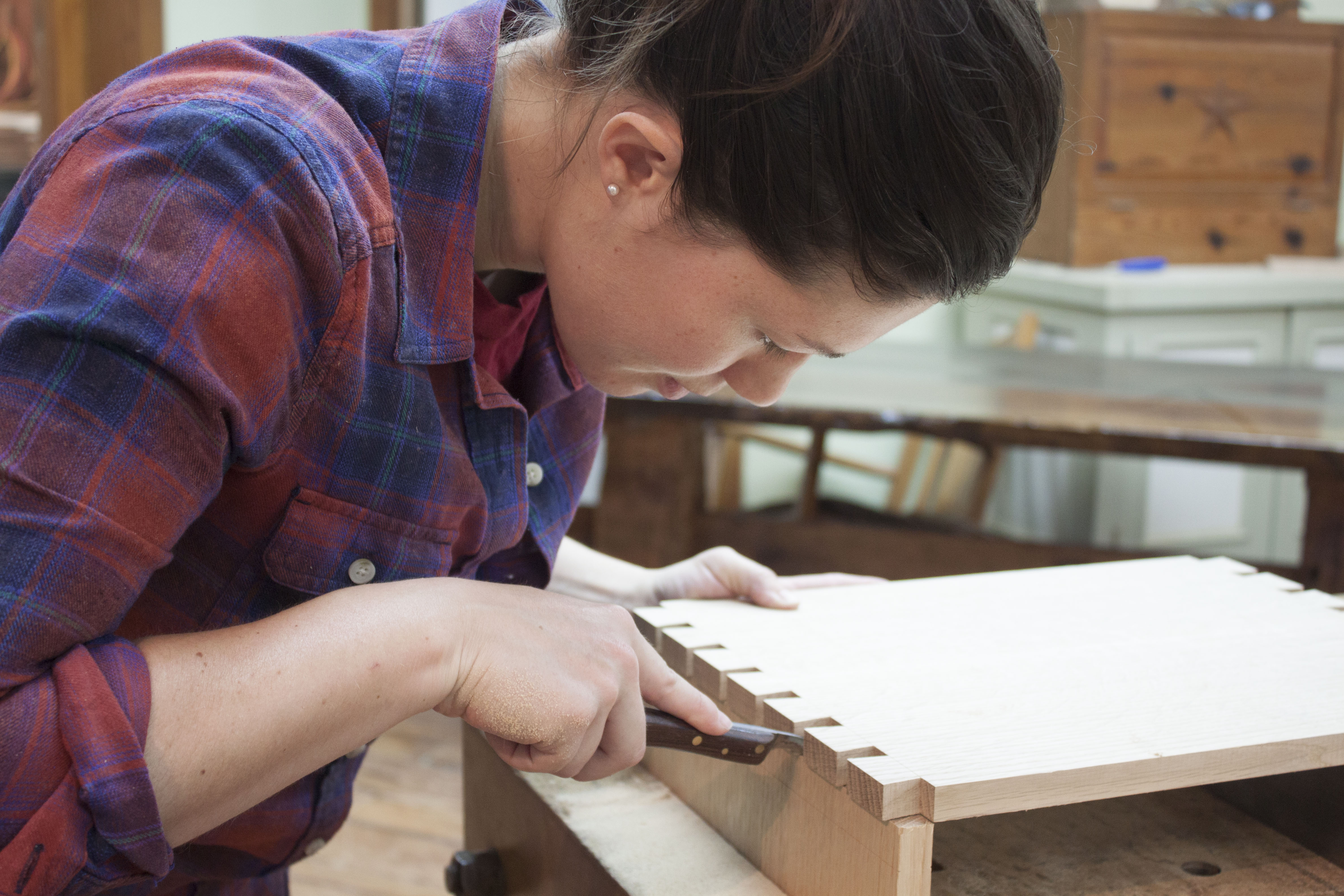 cutting into wood piece