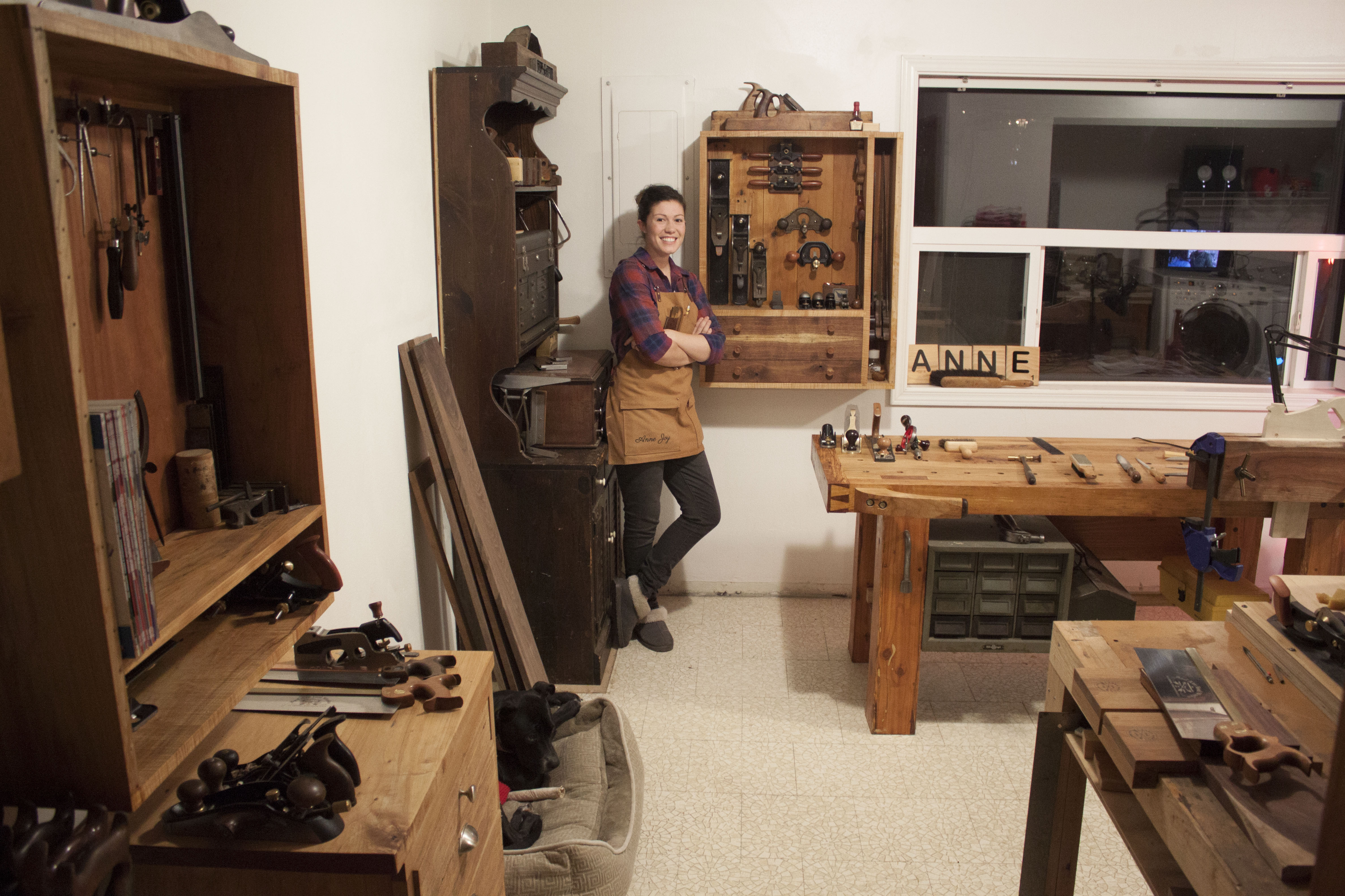 woman posing in a wood working shop