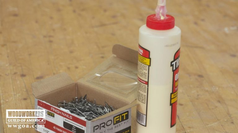 Box of nails and bottle of glue