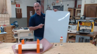 Man holding a whiteboard