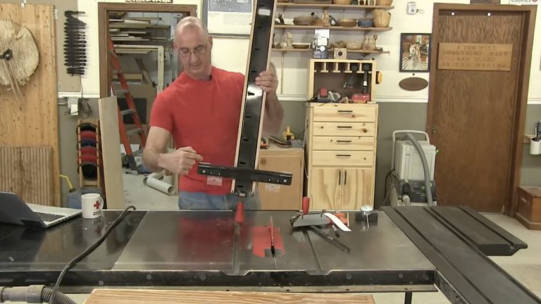Man setting up a table saw
