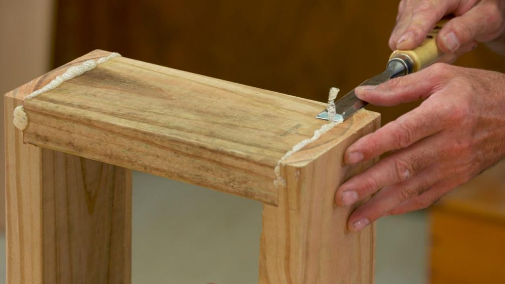 Scraping off excess glue