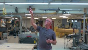 Man pointing to something in a workshop