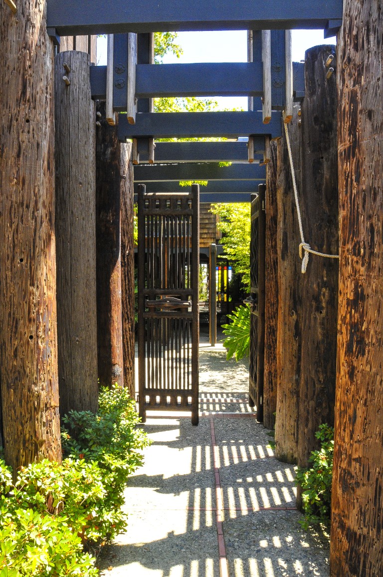 exterior walkway with a wooden gate