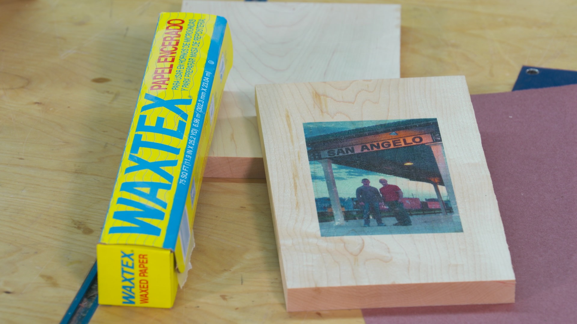 Wax paper and a photo on wood