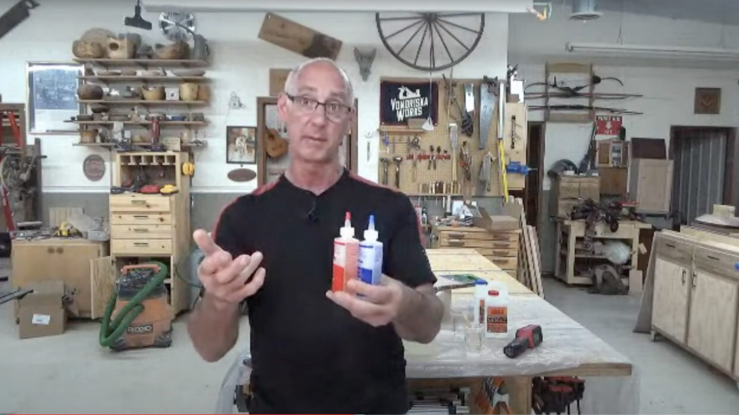 Man with two tubes of epoxy