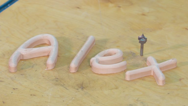 Small wooden letters spelling Alex