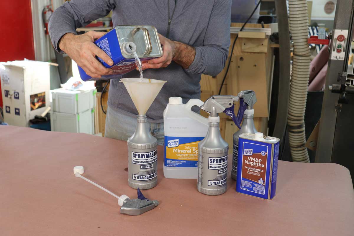 pouring a liquid into a spray master bottle