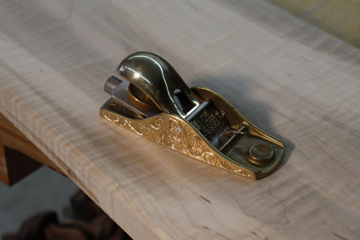 plane on a piece of wood