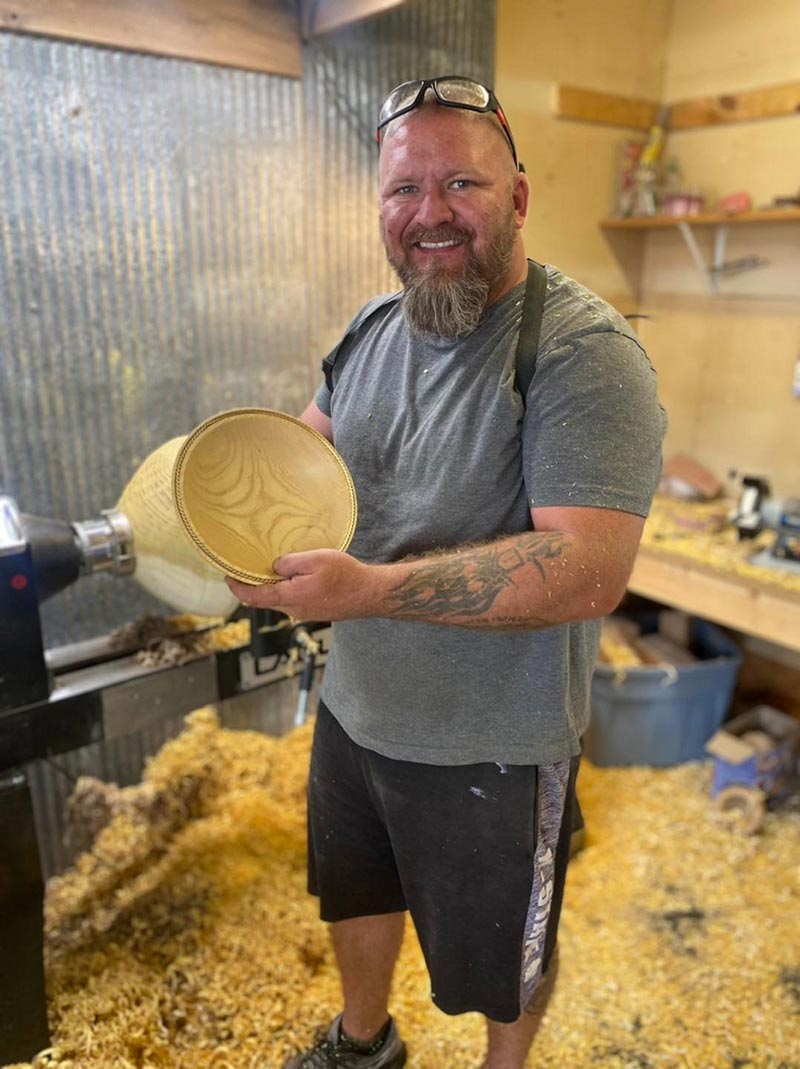 Man holding a wood turned bowl