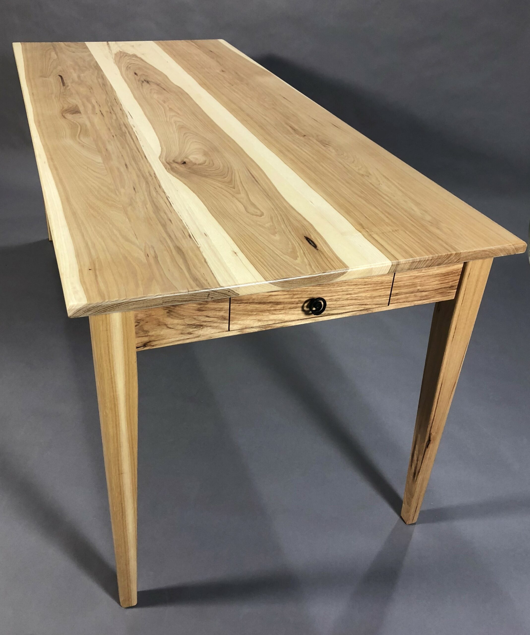 wooden table with a small drawer