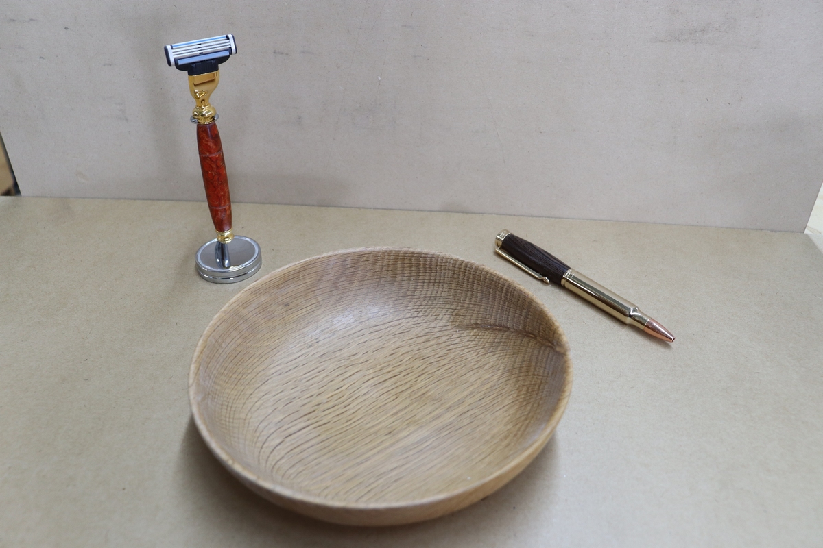 wooden epoxy bowl with a pen and razow