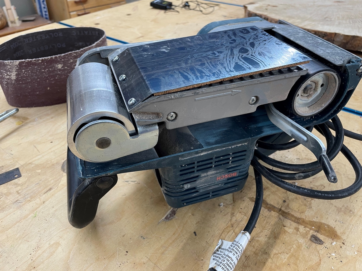 belt sander on a wooden table