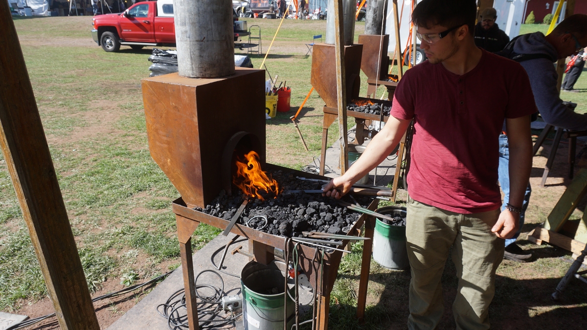 mean wearing protective eye wear forging metal