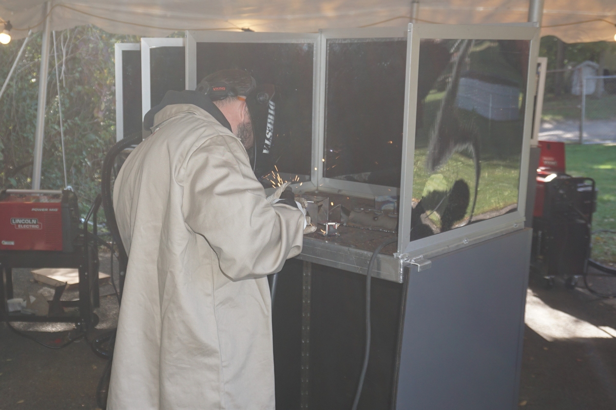 man welding wearing protective gear