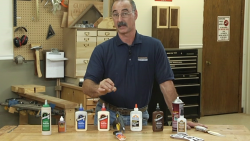 Man with a variety of glue bottles