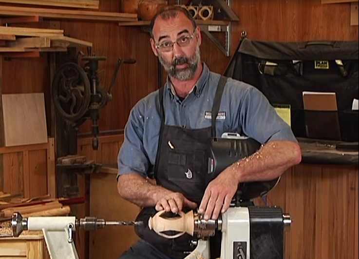 Man turning wood