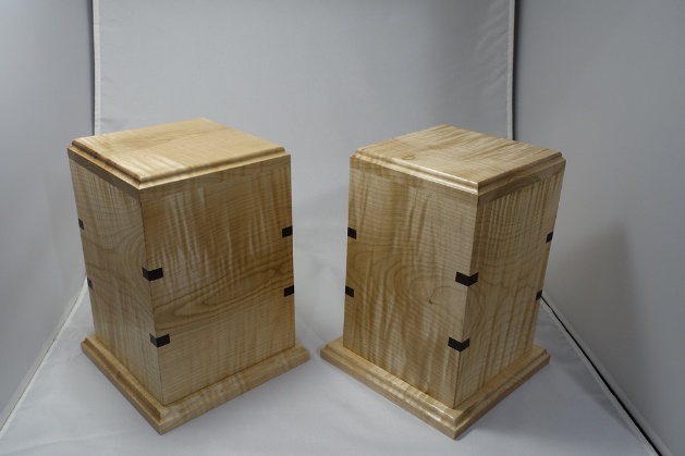 Two wooden cremation urns